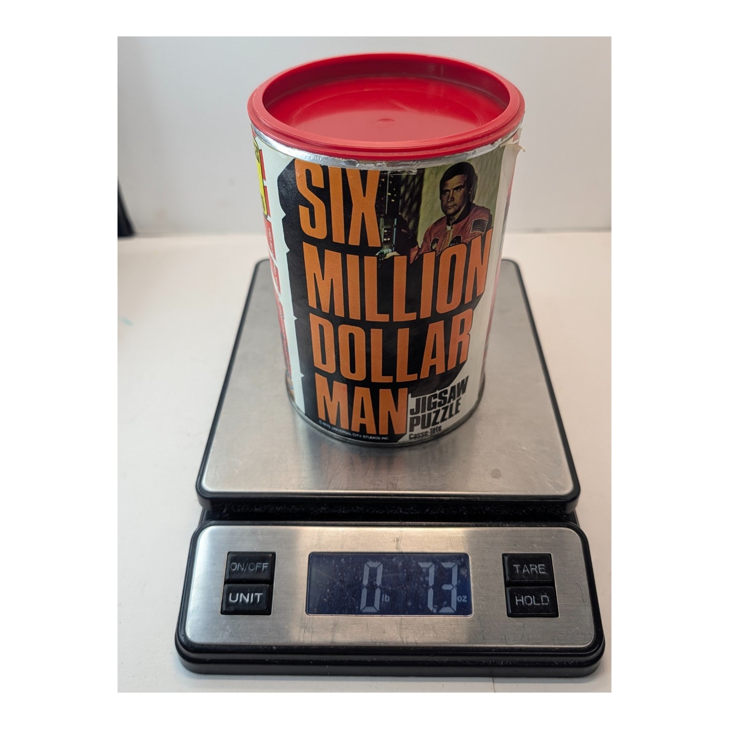 Vintage 1975 Six Million Dollar Man Jigsaw Puzzle in Can APC Collectible